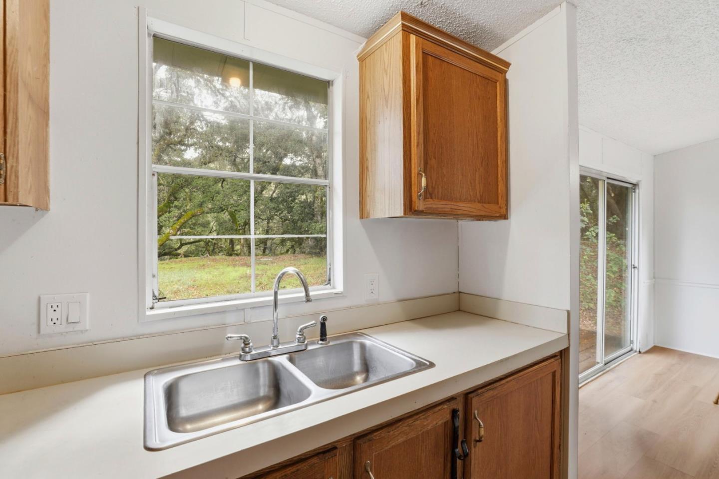 41800 Tassajara Road Carmel Valley, CA 93924 - Photo 22 of 51 a kitchen that has a sink and a window
