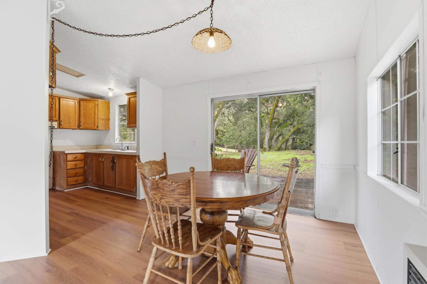 41800 Tassajara Road Carmel Valley, CA 93924 - Photo 25 of 51 a view of a dining room with furniture window and outside view