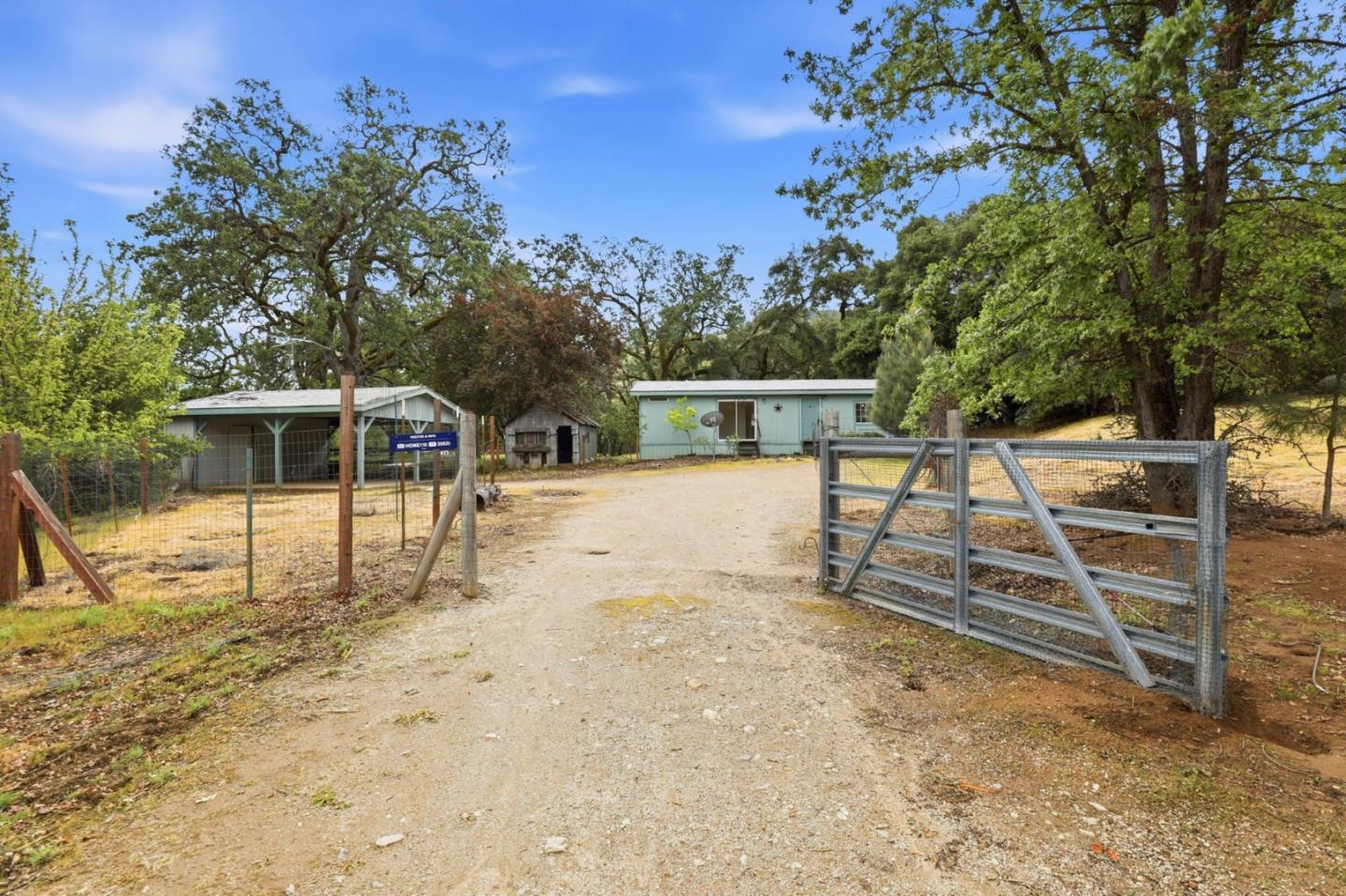 41800 Tassajara Road Carmel Valley, CA 93924 - Photo 3 of 51 a view of a house with backyard porch and sitting area