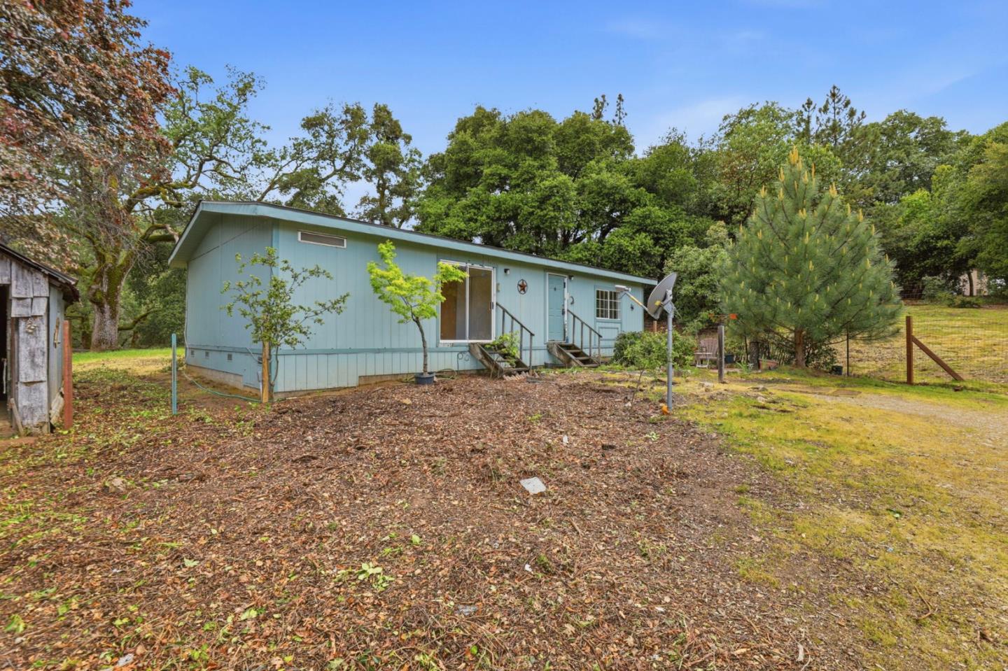 41800 Tassajara Road Carmel Valley, CA 93924 - Photo 8 of 51 a backyard of a house with lots of green space