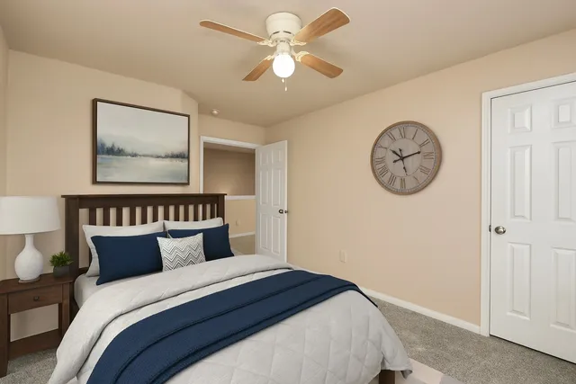 a bedroom with a bed and a large closet