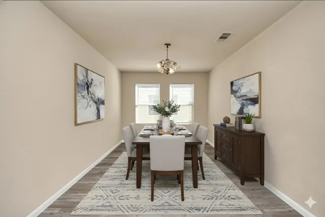 a view of a dining room with furniture