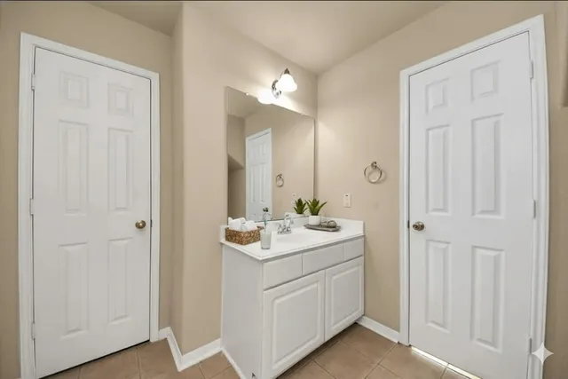 a room with a sink and a mirror