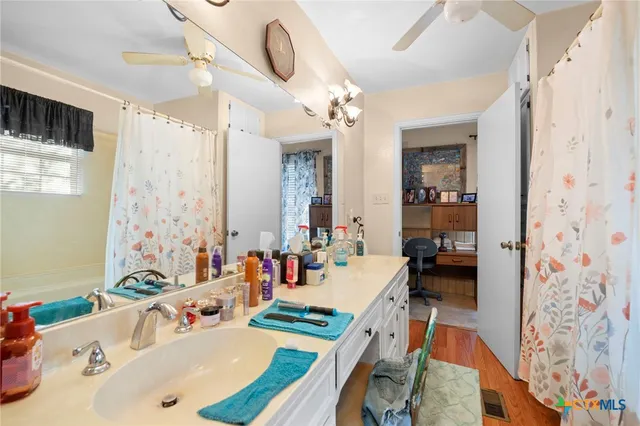 a bathroom with a bathtub and shower curtain
