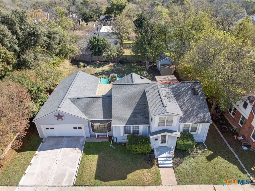 1213 North Main Street Temple, TX 76501 - Photo 3 of 37 an aerial view of a house with a yard