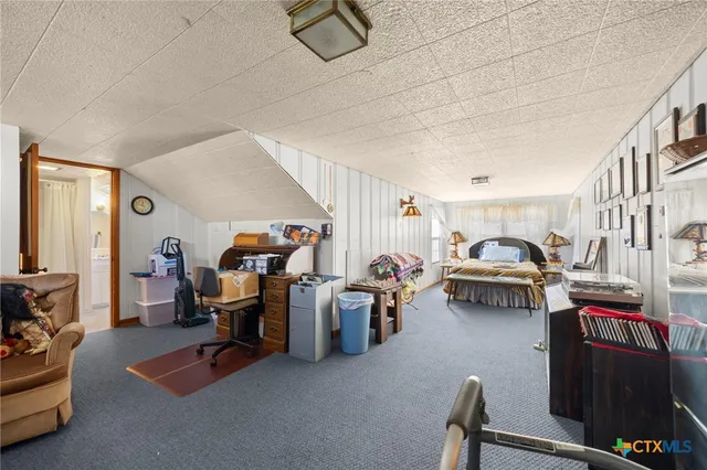 a view of a livingroom with furniture and a livingroom