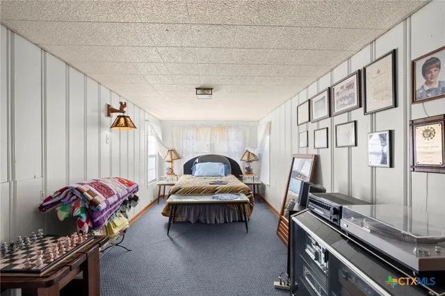 a bedroom with bed and a window