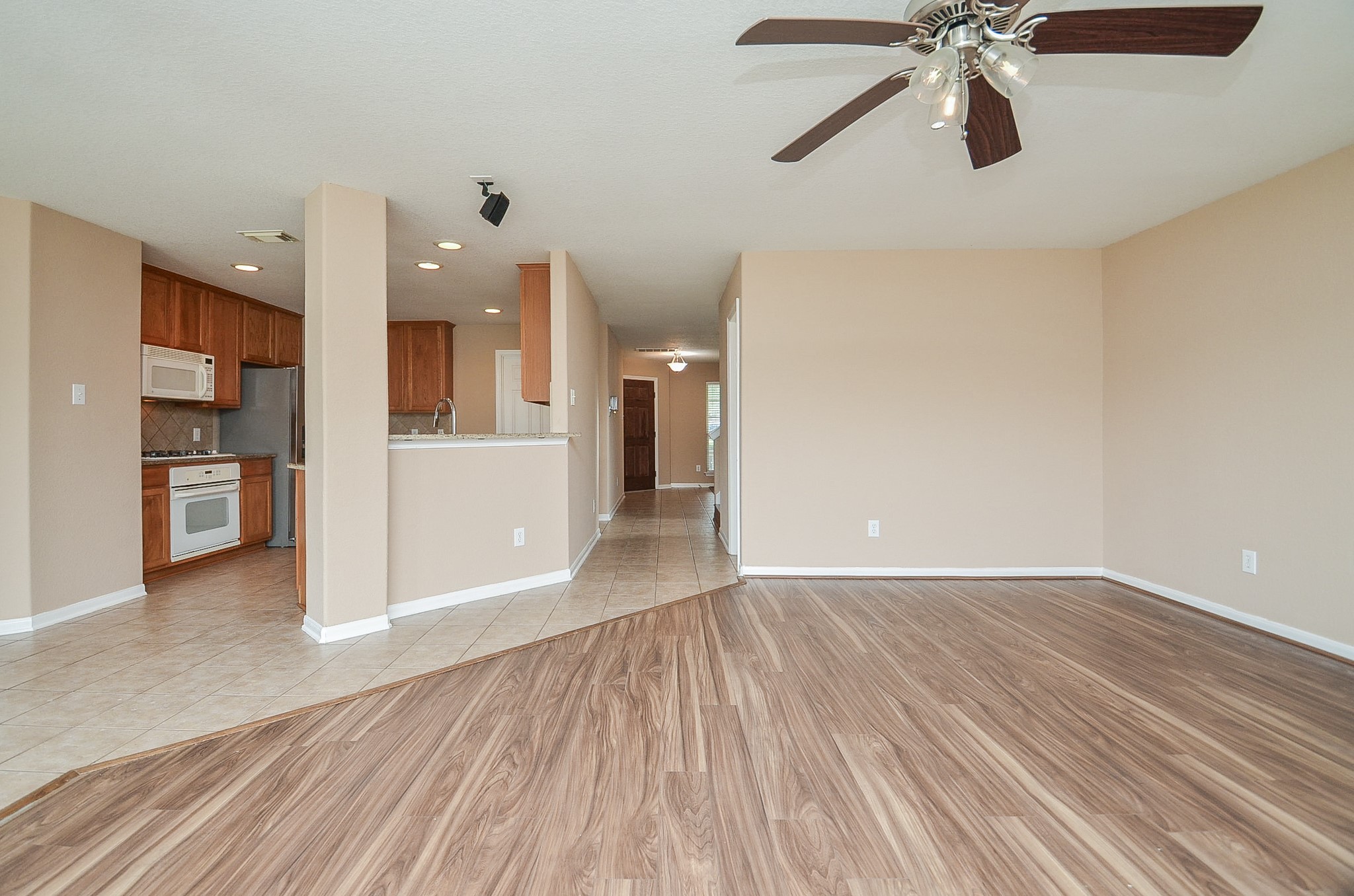 7134 Winston Ranch Parkway Richmond, TX 77406 - Photo 12 of 35 What a gorgeous open view from back to front in the living area, right up to the front entry!