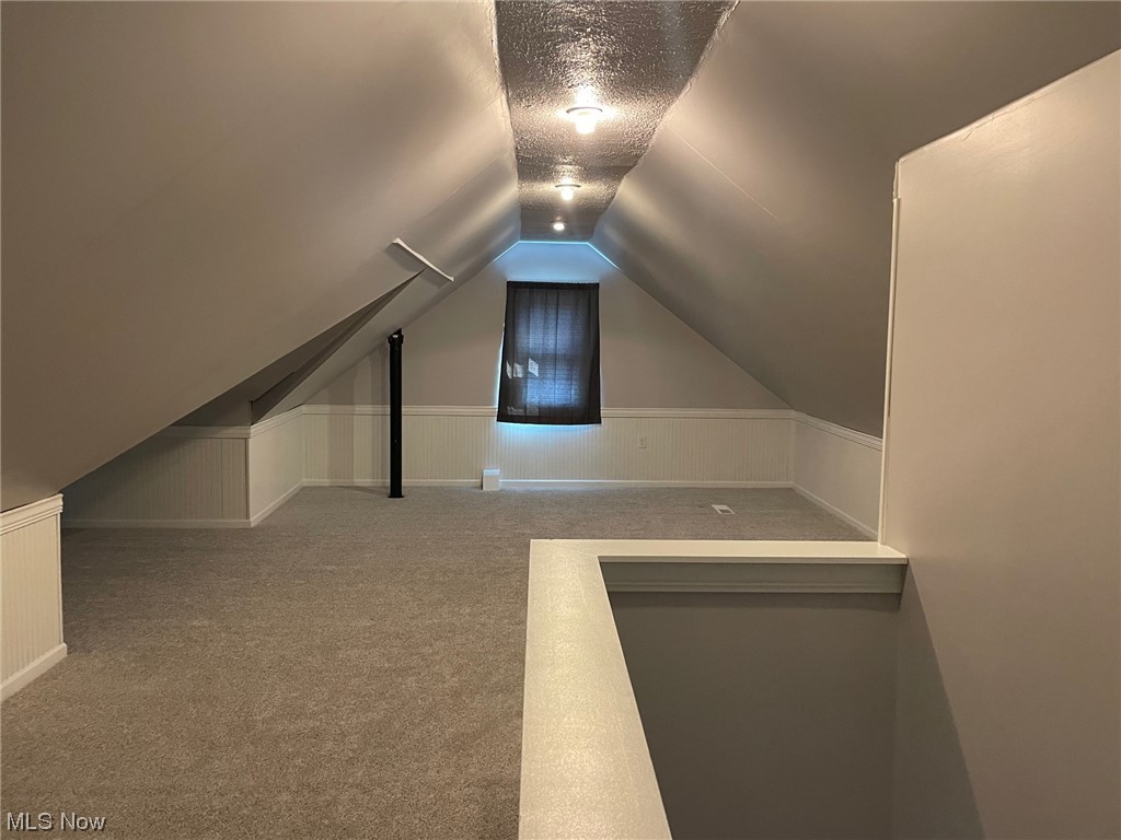 5972 Crossview Road Independence, OH 44131 - Photo 13 of 33 Bonus room featuring light carpet and lofted ceiling