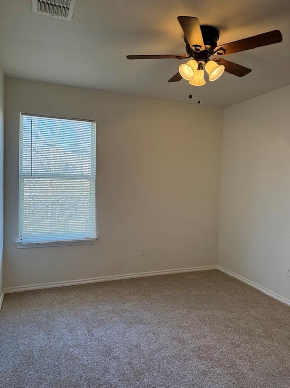 1221 Village Garden Azle, TX 76020 - Photo 19 of 23 an empty room with a window