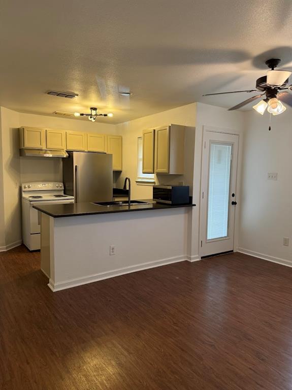 1221 Village Garden Azle, TX 76020 - Photo 4 of 23 a view of a kitchen with a sink and dishwasher wooden floor