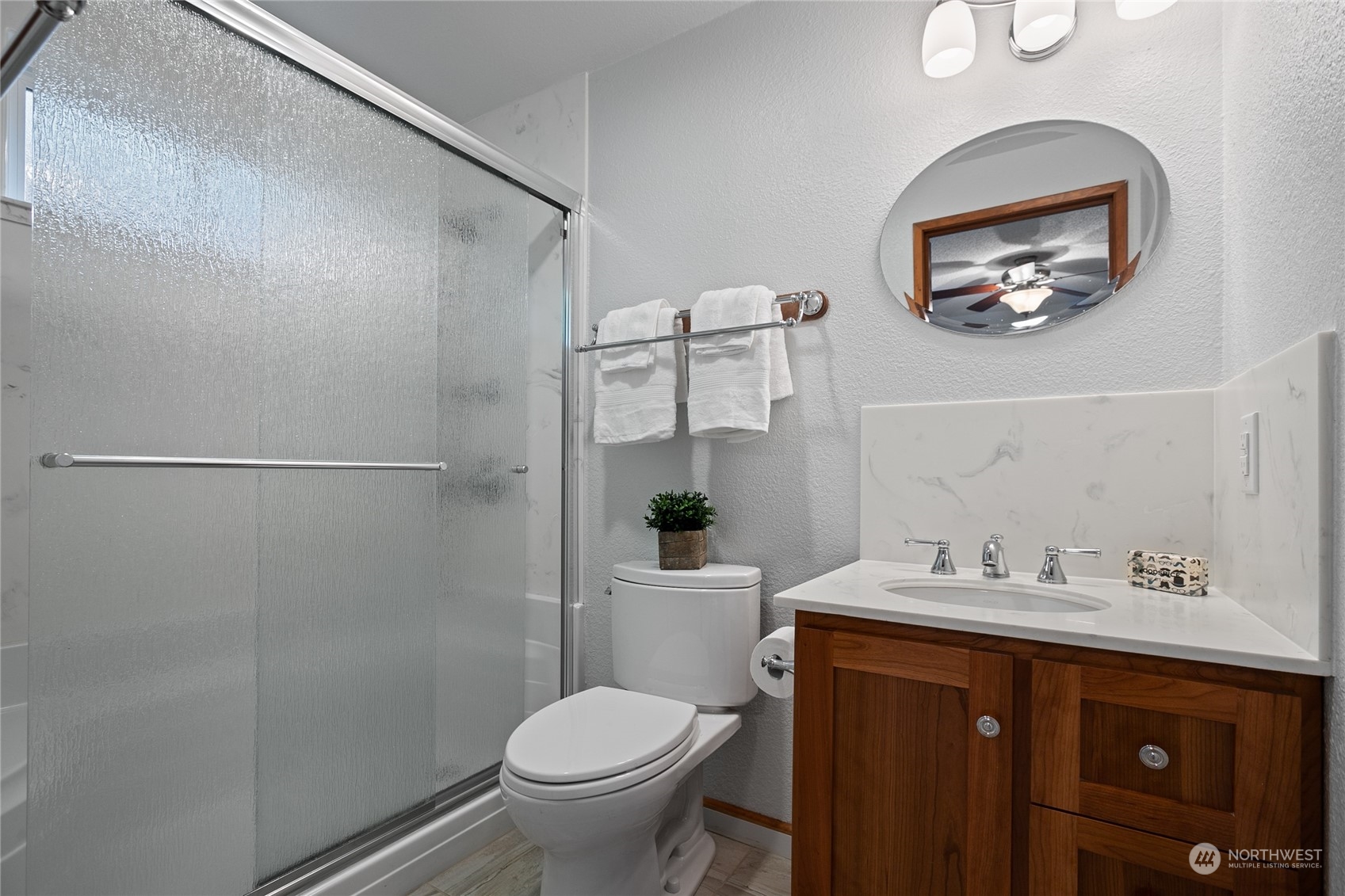 1801 224th Street Southwest Bothell, WA 98021 - Photo 11 of 24 a bathroom with a granite countertop toilet sink and shower