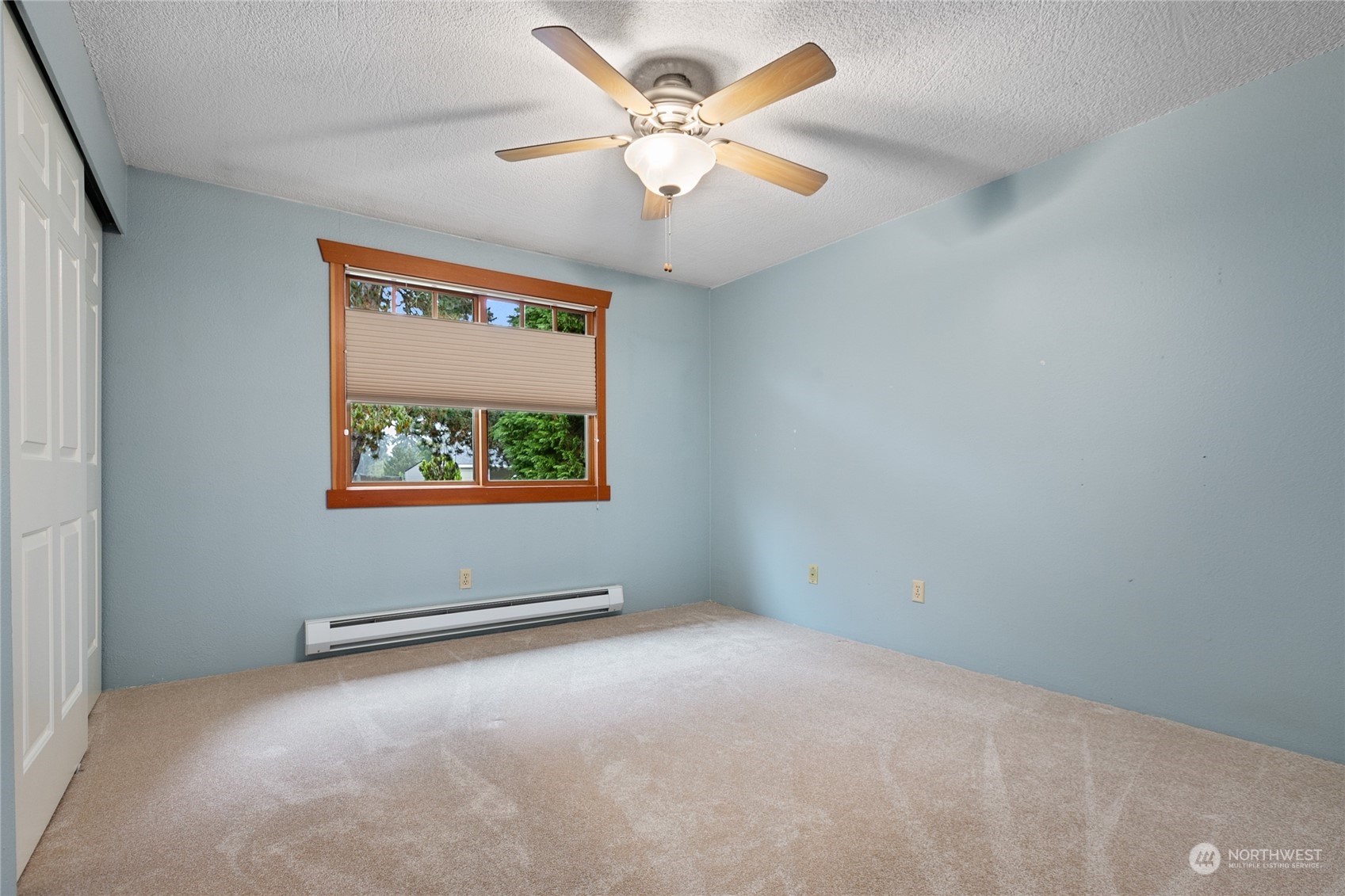 1801 224th Street Southwest Bothell, WA 98021 - Photo 13 of 24 an empty room with windows and fan