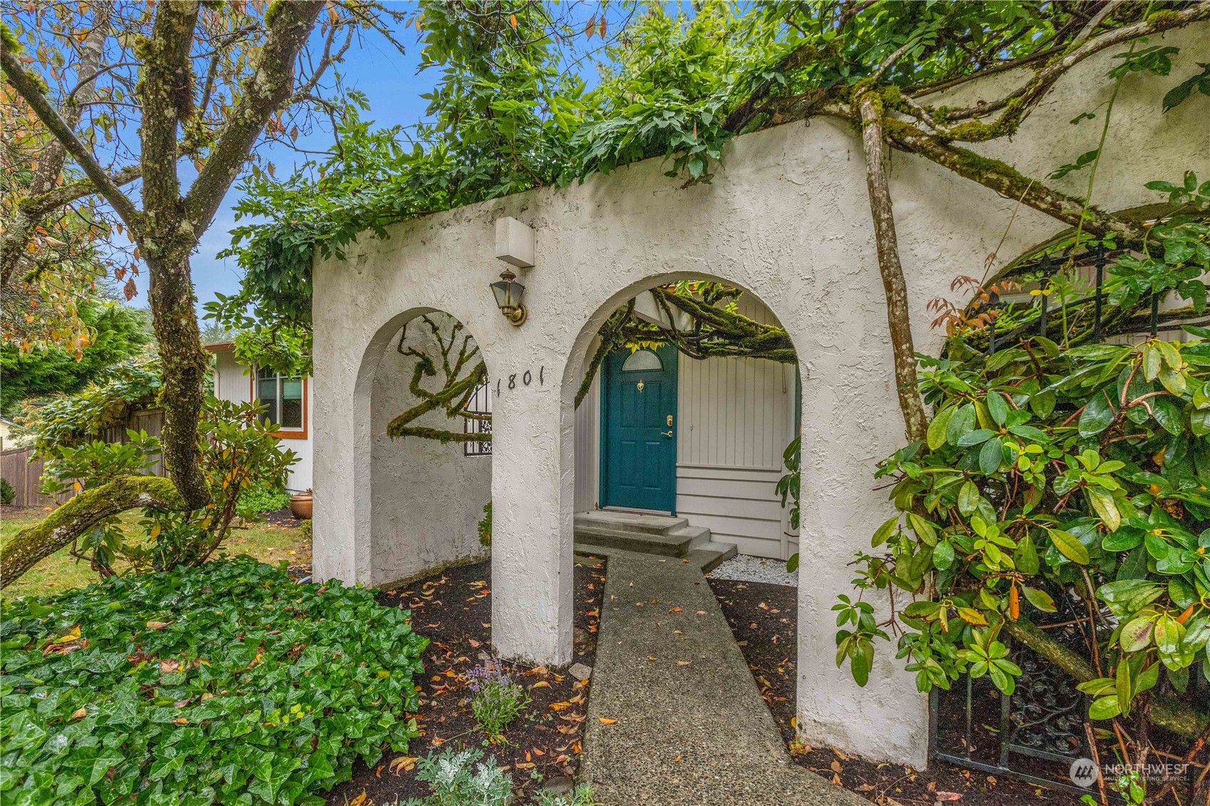 1801 224th Street Southwest Bothell, WA 98021 - Photo 2 of 24 a front view of a house with garden