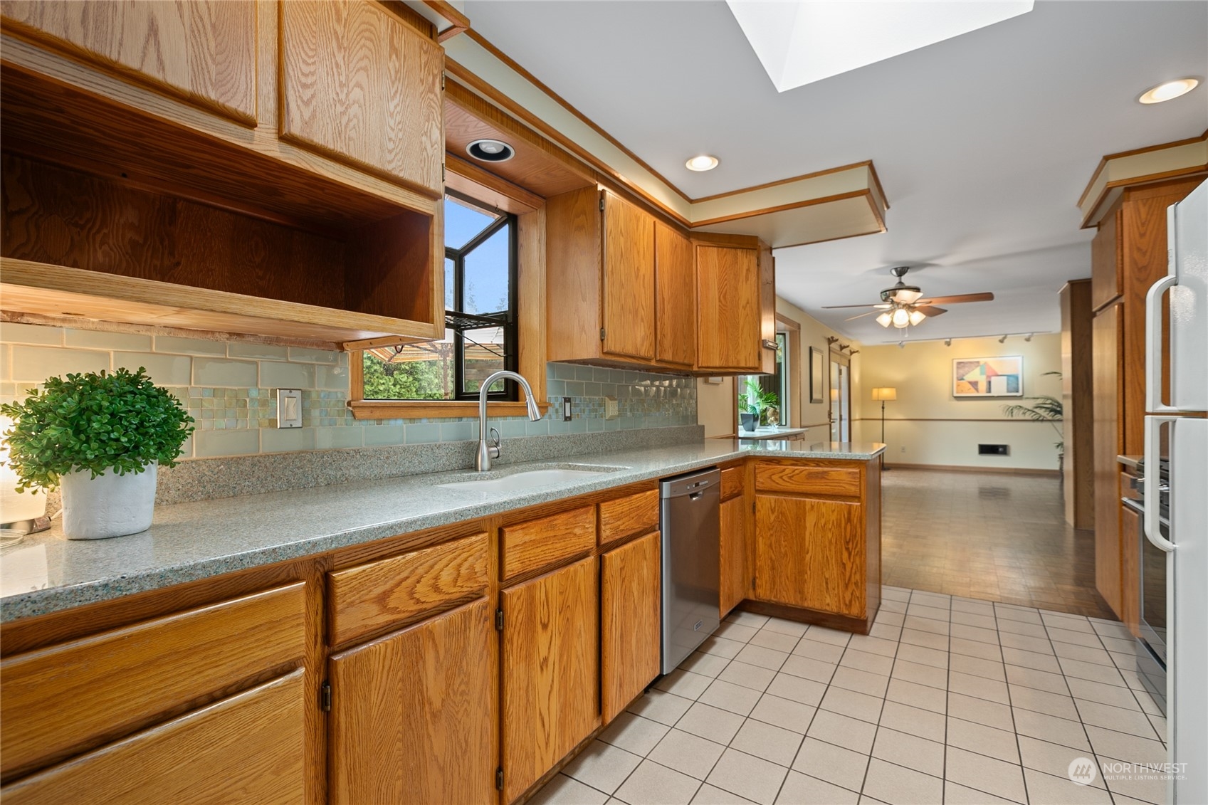 1801 224th Street Southwest Bothell, WA 98021 - Photo 9 of 24 a kitchen with stainless steel appliances granite countertop a sink and cabinets