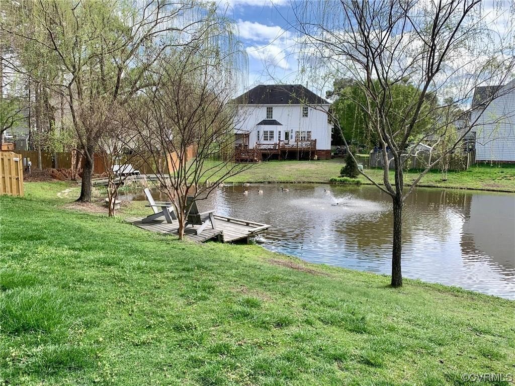 2540 Dunham Road Henrico, VA 23233 - Photo 39 of 40 a view of a lake with a building in the background