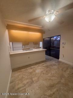 7002 70th Way, Unit 7002 West Palm Beach, FL 33407 - Photo 16 of 39 a view of kitchen and wooden floor