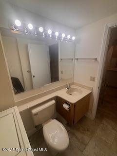 7002 70th Way, Unit 7002 West Palm Beach, FL 33407 - Photo 20 of 39 a bathroom with a sink mirror vanity and toilet