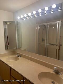 7002 70th Way, Unit 7002 West Palm Beach, FL 33407 - Photo 22 of 39 a bathroom with a sink a vanity and a mirror