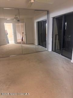 7002 70th Way, Unit 7002 West Palm Beach, FL 33407 - Photo 27 of 39 a room with a bed and a mirror