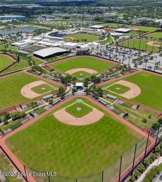 7002 70th Way, Unit 7002 West Palm Beach, FL 33407 - Photo 33 of 39 a view of a swimming pool with a yard