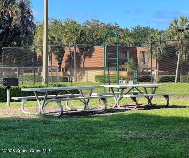 7002 70th Way, Unit 7002 West Palm Beach, FL 33407 - Photo 35 of 39 a view of playground with a slide and bench