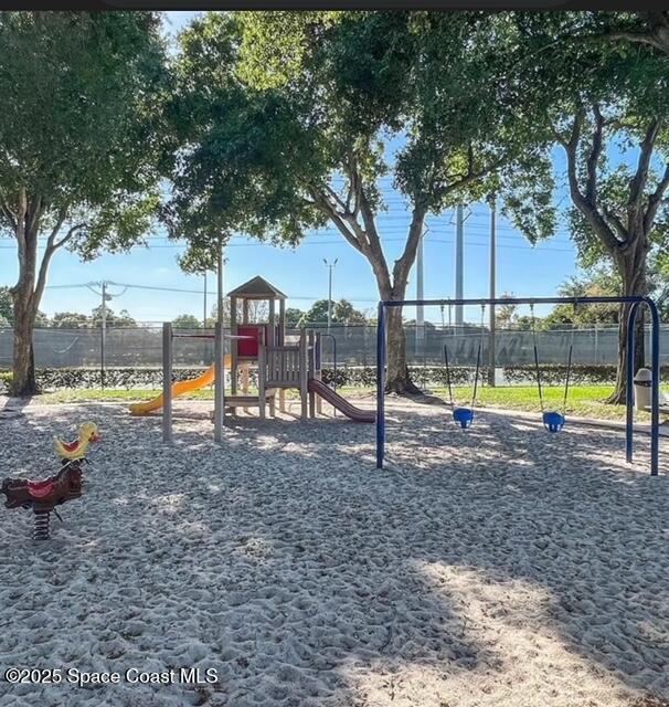 7002 70th Way, Unit 7002 West Palm Beach, FL 33407 - Photo 36 of 39 a view of a park with a slide