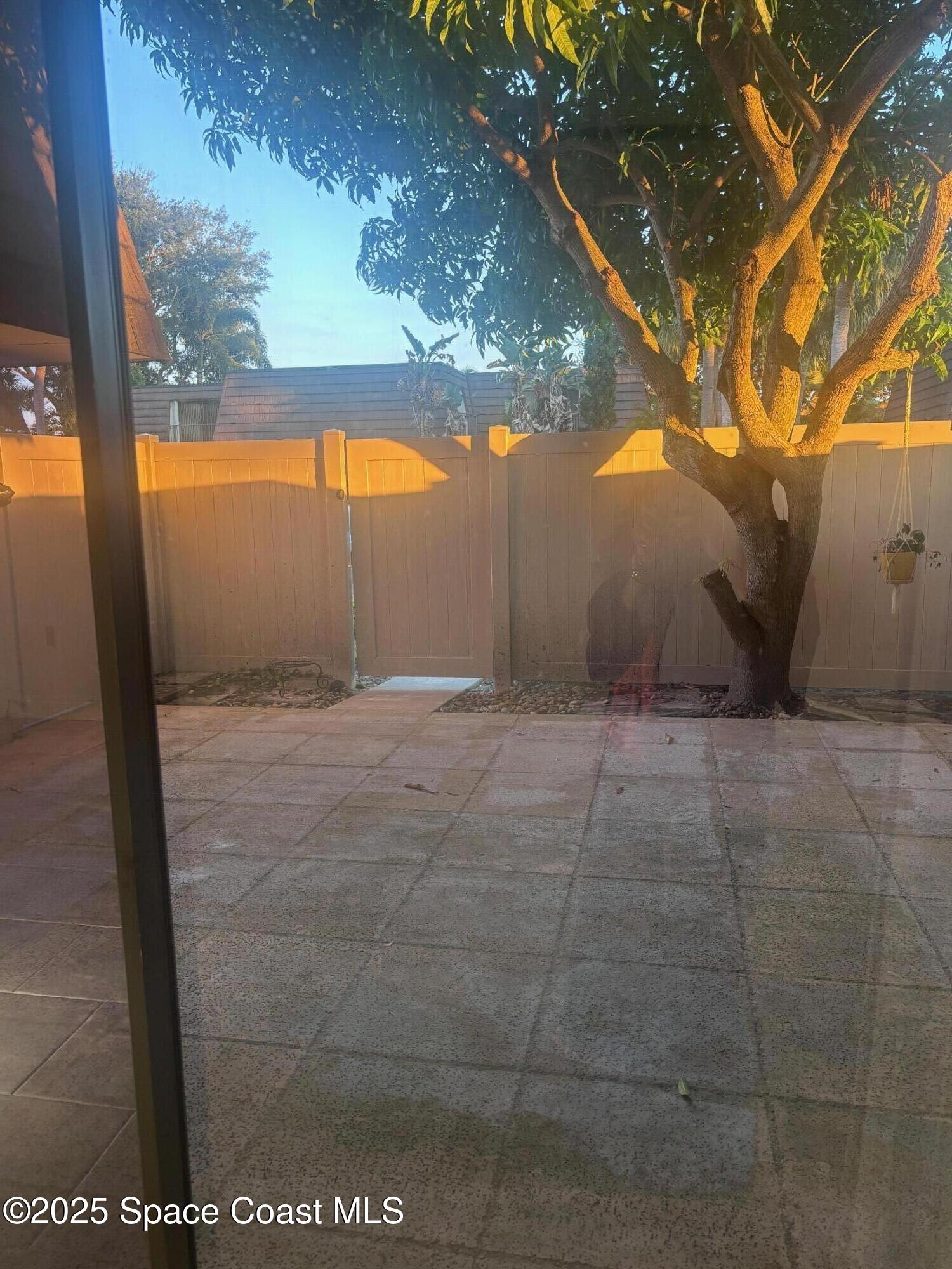 7002 70th Way, Unit 7002 West Palm Beach, FL 33407 - Photo 4 of 39 a view of backyard with green space