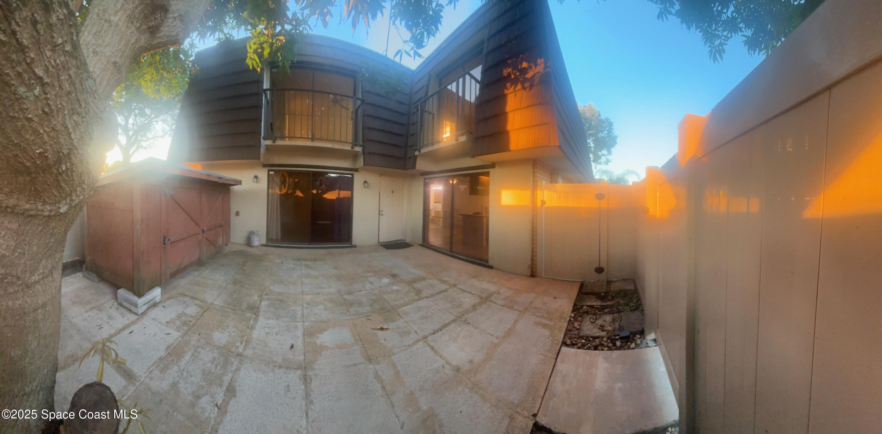 7002 70th Way, Unit 7002 West Palm Beach, FL 33407 - Photo 7 of 39 a view of a house with a yard