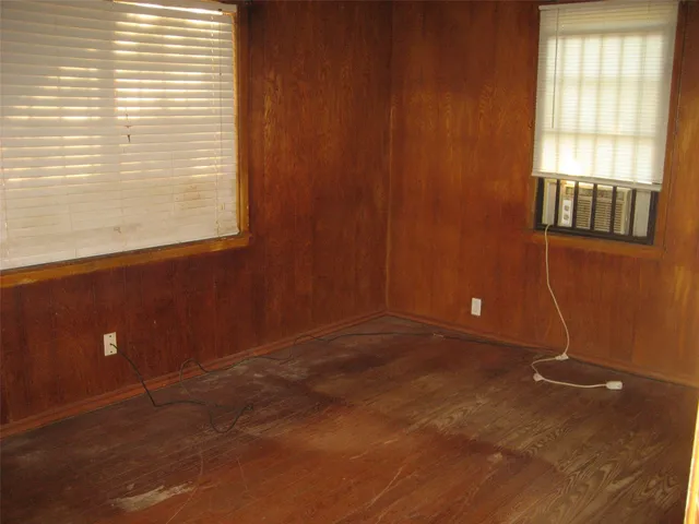 an empty room with windows