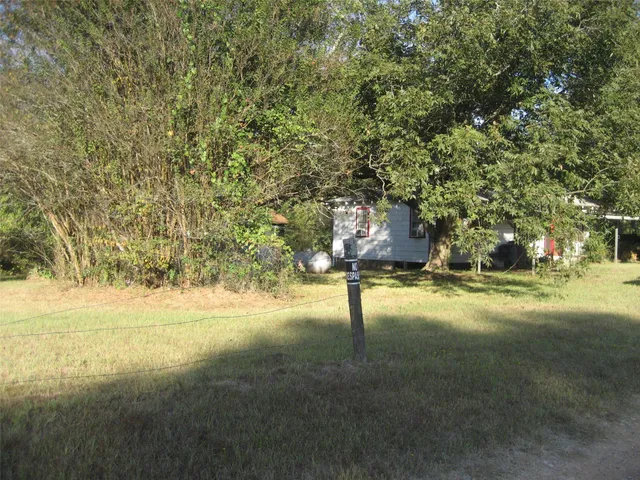 a view of a back yard of the house