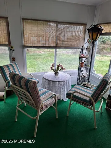 a view of a livingroom with furniture and a table