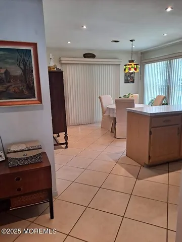 a view of kitchen with furniture and a window