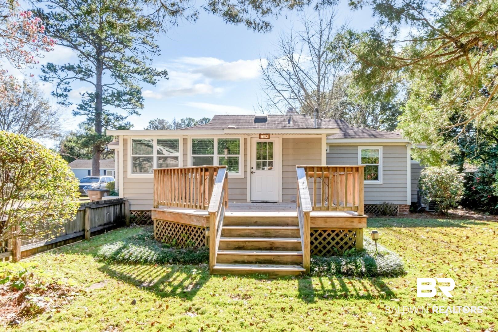 10 South Hathaway Road Mobile, AL 36608 - Photo 40 of 46 Back of house with a yard and a wooden deck