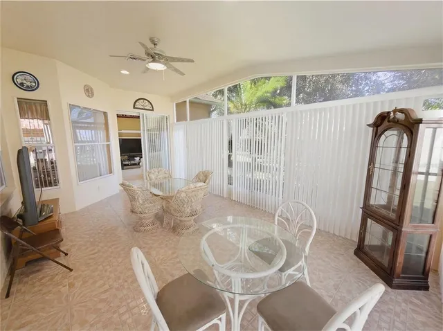 an aerial view of residential houses with outdoor space and swimming pool