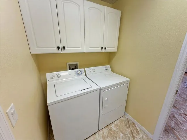 a living room with fireplace furniture and a wooden floor