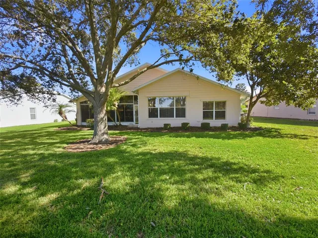 a view of a livingroom with furniture and a bookshelf