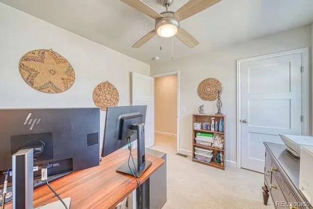 a view of a workspace with furniture