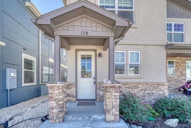a front view of a house with many windows