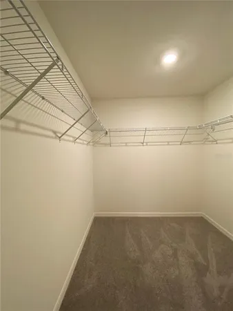 a bathroom with a toilet a sink and shower