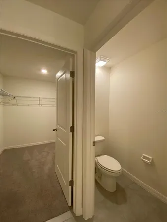 a bathroom with a shower and a glass door