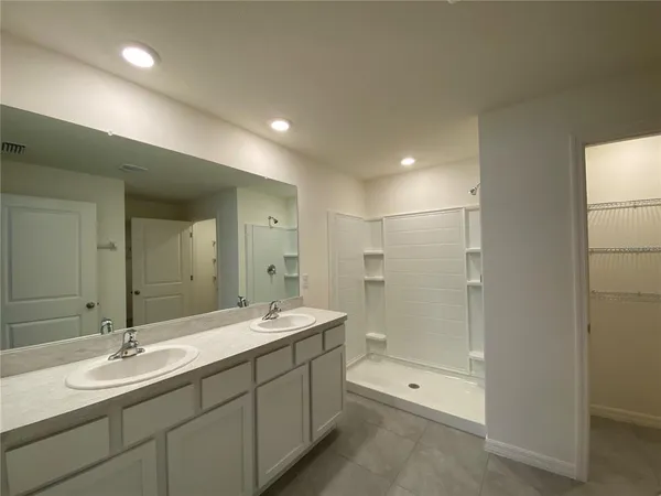 a view of an empty room and a window