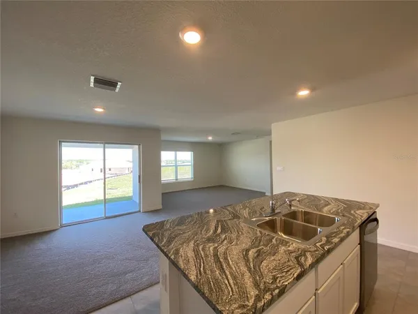 a kitchen with a sink and window