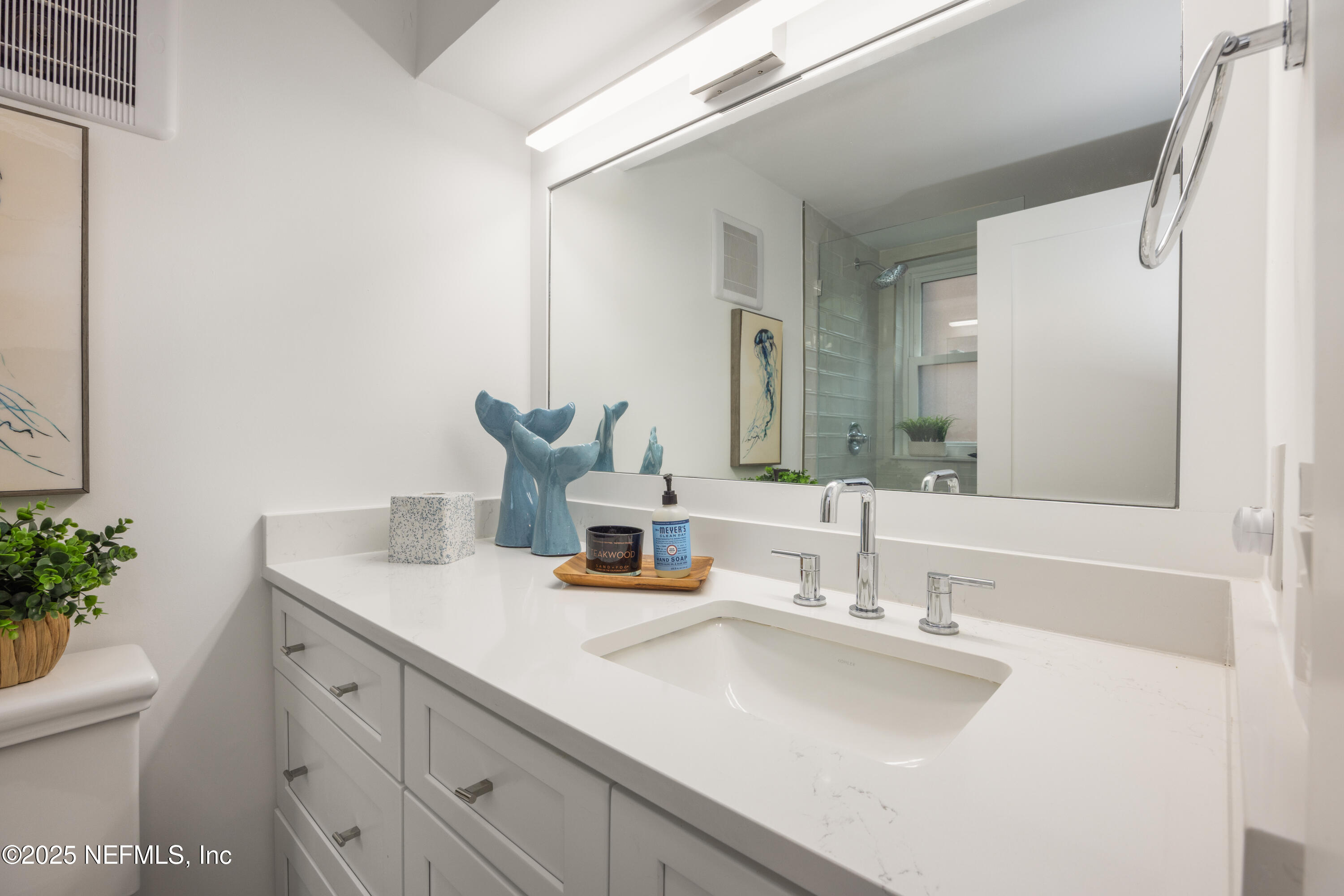 2277 Seminole Road, Unit M Atlantic Beach, FL 32233 - Photo 35 of 49 a bathroom with a sink and a mirror