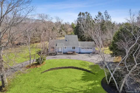 a view of a swimming pool with a yard