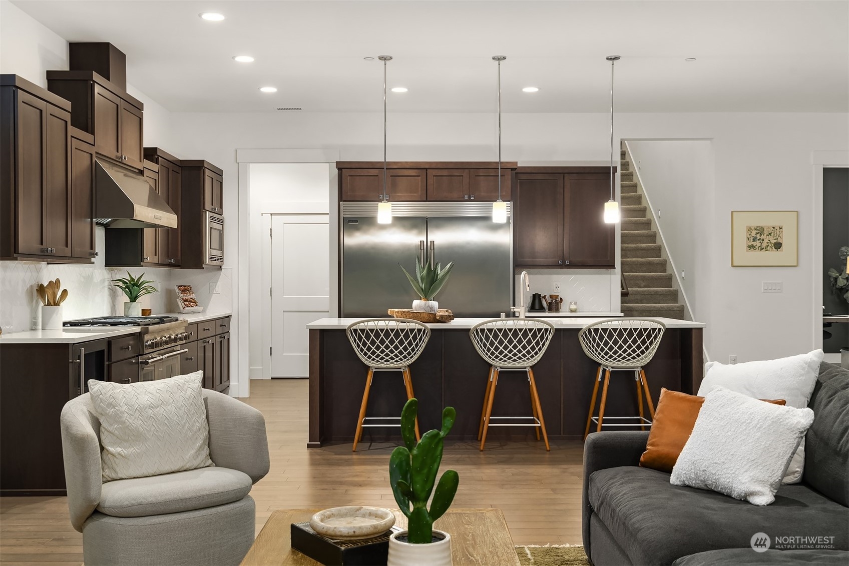 36234 Southeast Fish Hatchery Road Fall City, WA 98024 - Photo 12 of 40 a living room with stainless steel appliances kitchen island granite countertop furniture and a view of kitchen