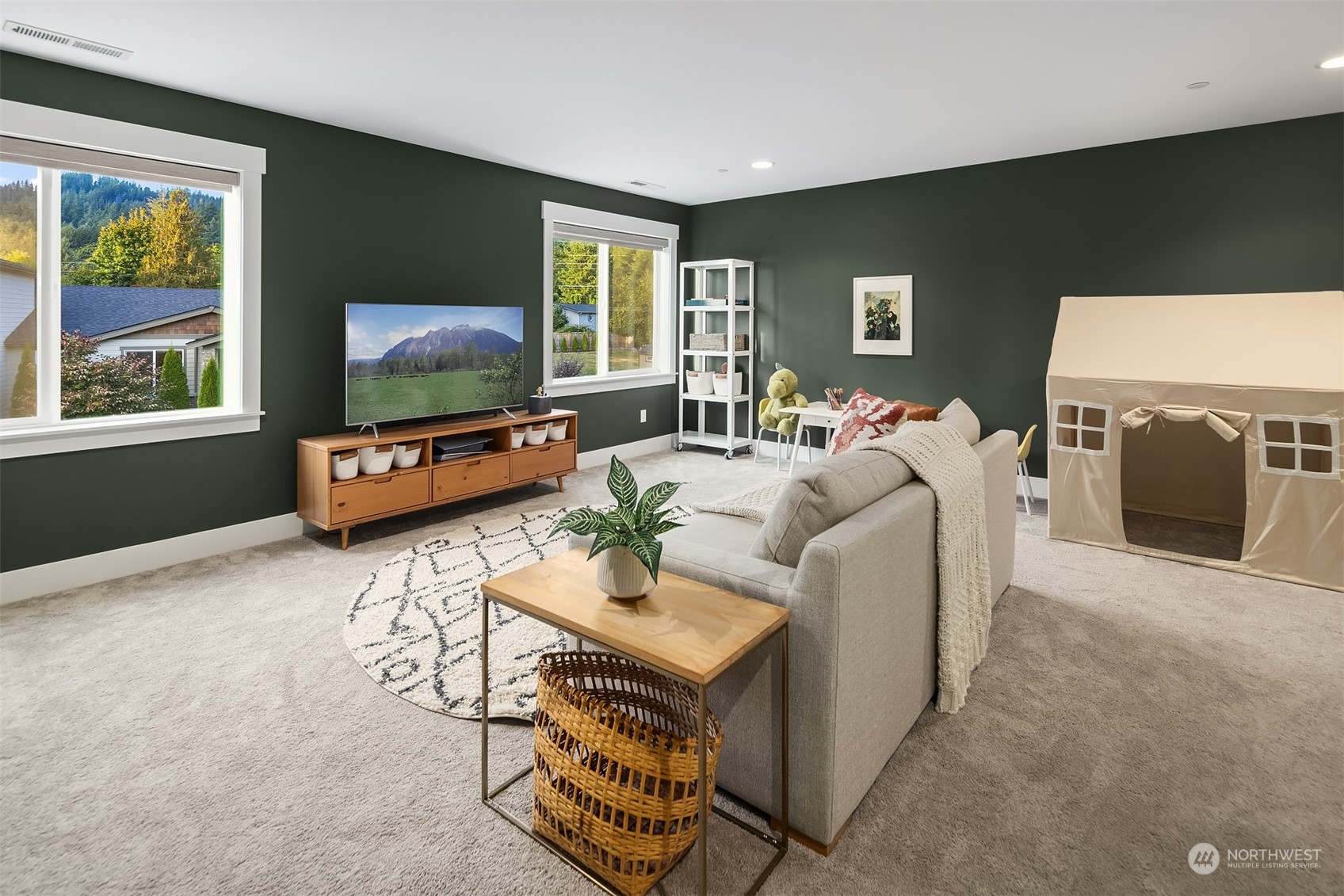 36234 Southeast Fish Hatchery Road Fall City, WA 98024 - Photo 25 of 40 a living room with furniture a flat screen tv and a window