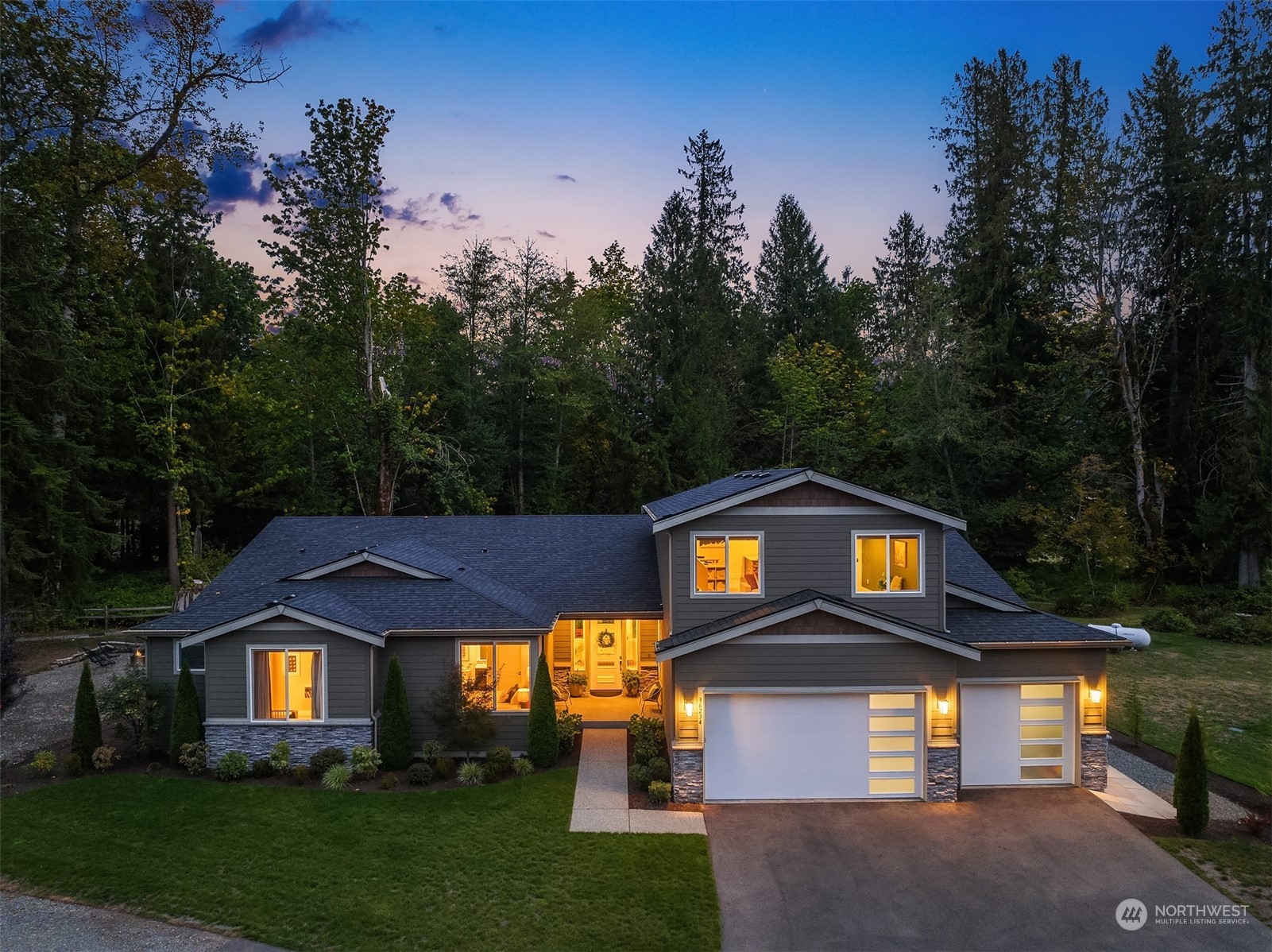 36234 Southeast Fish Hatchery Road Fall City, WA 98024 - Photo 33 of 40 a front view of a house with a yard and garage