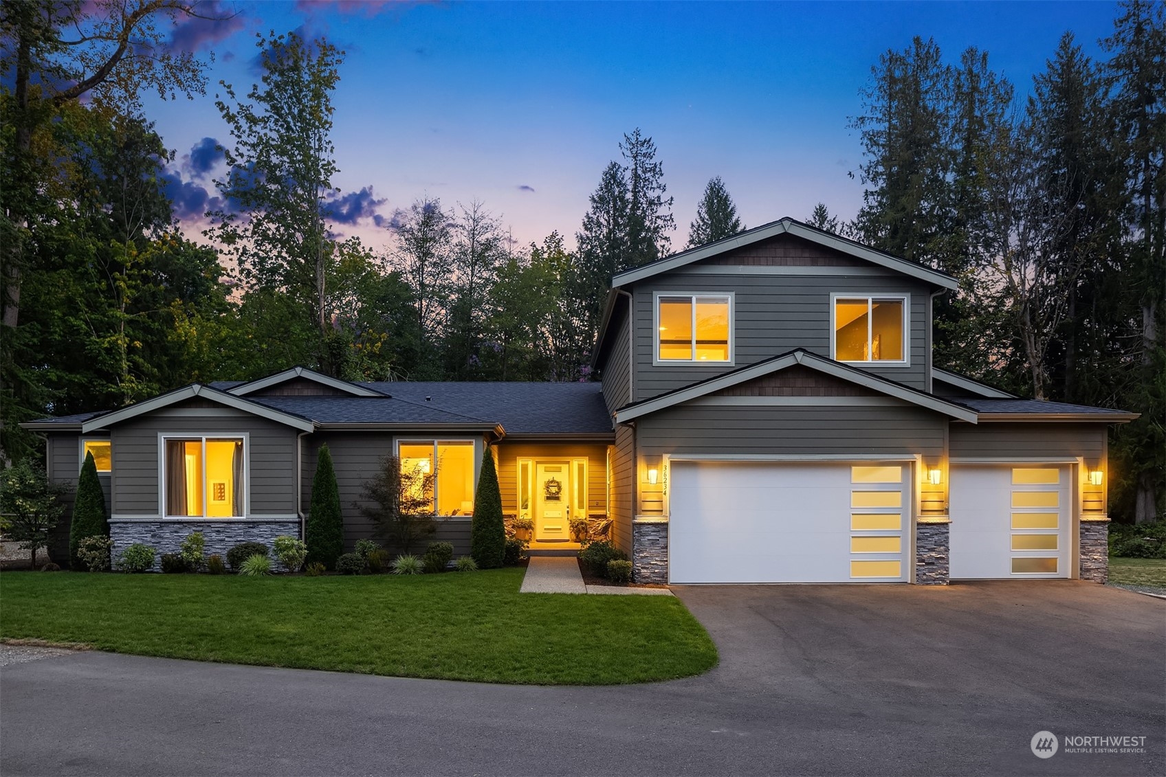36234 Southeast Fish Hatchery Road Fall City, WA 98024 - Photo 34 of 40 a front view of a house with a yard and garage