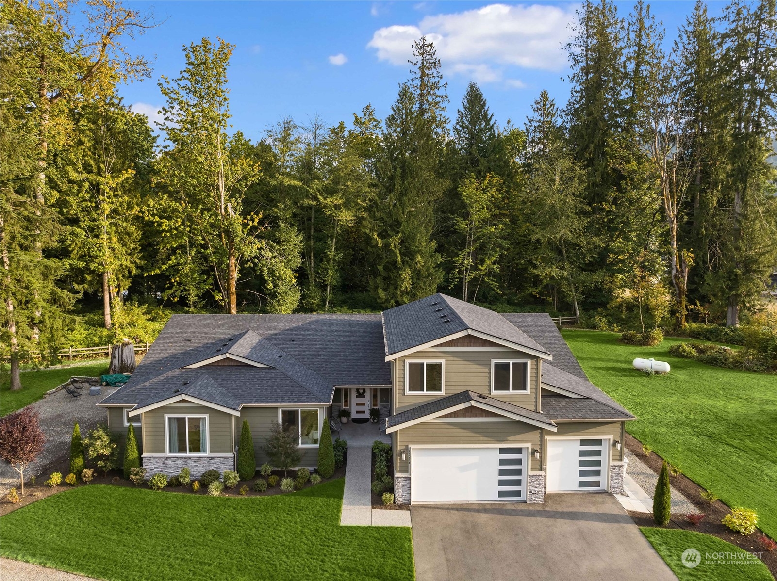 36234 Southeast Fish Hatchery Road Fall City, WA 98024 - Photo 36 of 40 a front view of a house with a yard